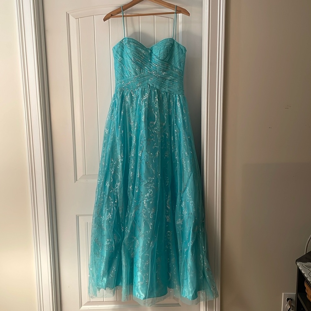 Teal ballgown prom dress with glitter details on the skirt